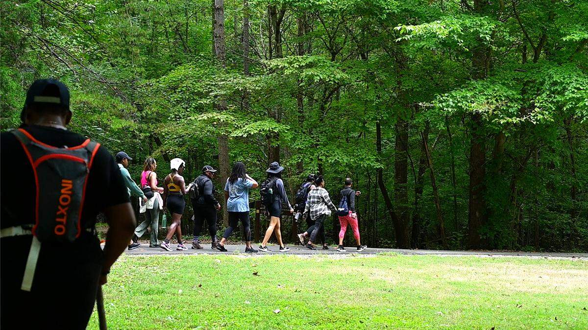 A group of women from “Black Girls Do Hike,” an organization established to promote a healthier lifestyle for women of color, are exploring nature for mental and physical well-being at Reedy Creek Park, a 125-acre urban park in East Charlotte, North Carolina.