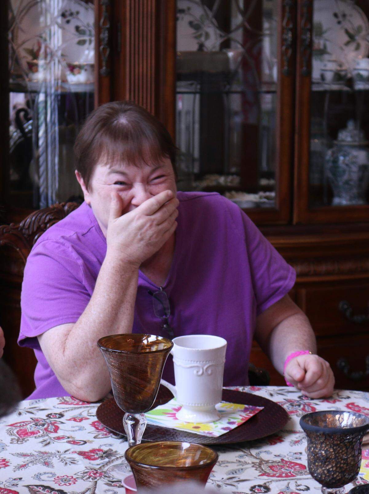 Beth Davis laughs at the table at McNinch House Restaurant, where she worked alongside her mother Ellen Davis, owner of the Charlotte restaurant.