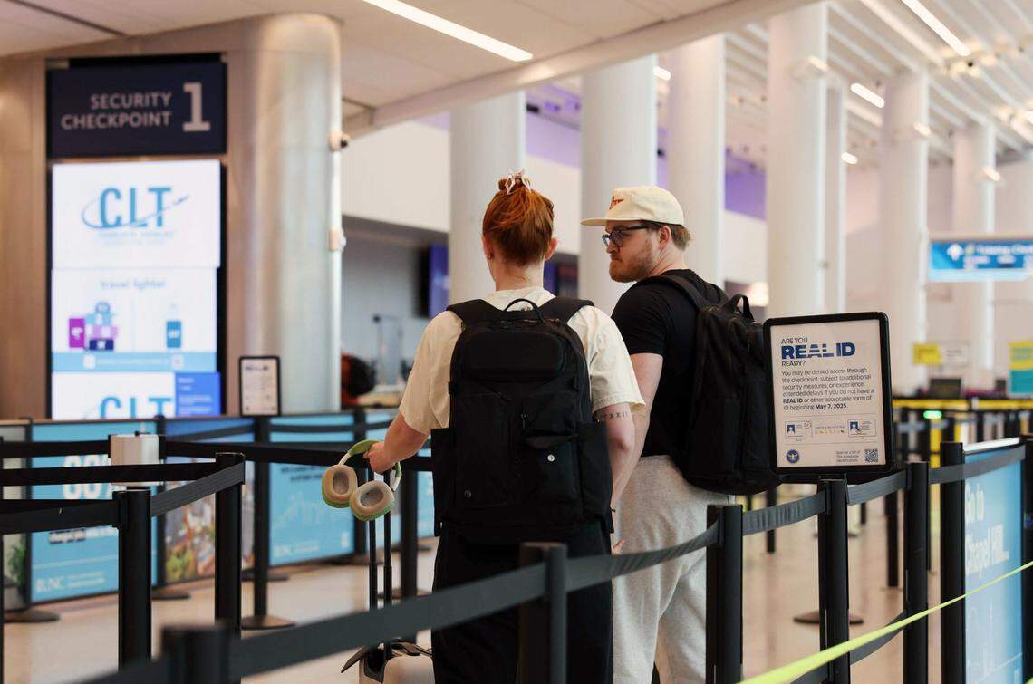 Real ID is now required for travelers traveling in US. A signage is posted at the entrance to the security line at Charlotte Douglas International Airport to remind travelers on Wednesday, May 7, 2025.