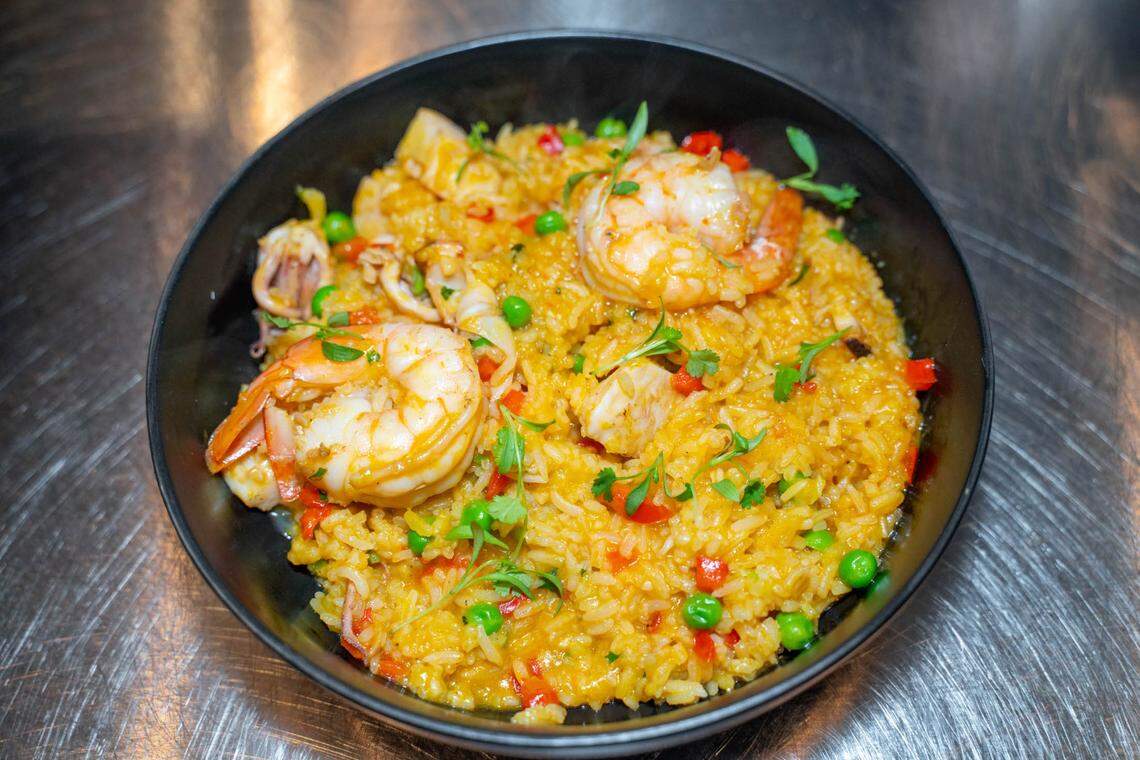 Yunta’s arroz con marisos with jasmine rice, octopus, shrimp, scallops, squid, aji panca, miso, parmesan cheese.