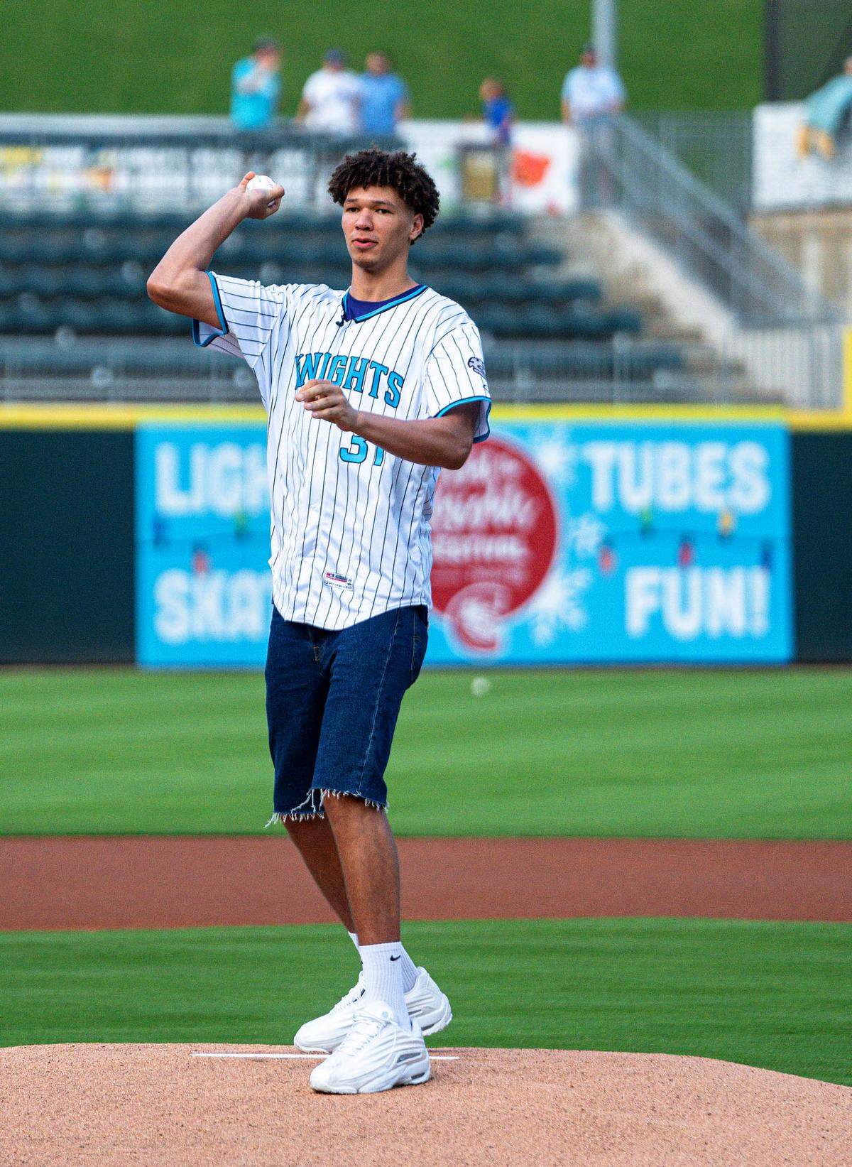 Charlotte Hornets rookies Tidjane Salaun throws the first pitch at the Knights game at Truist Field on Thursday night, August 15, 2024.