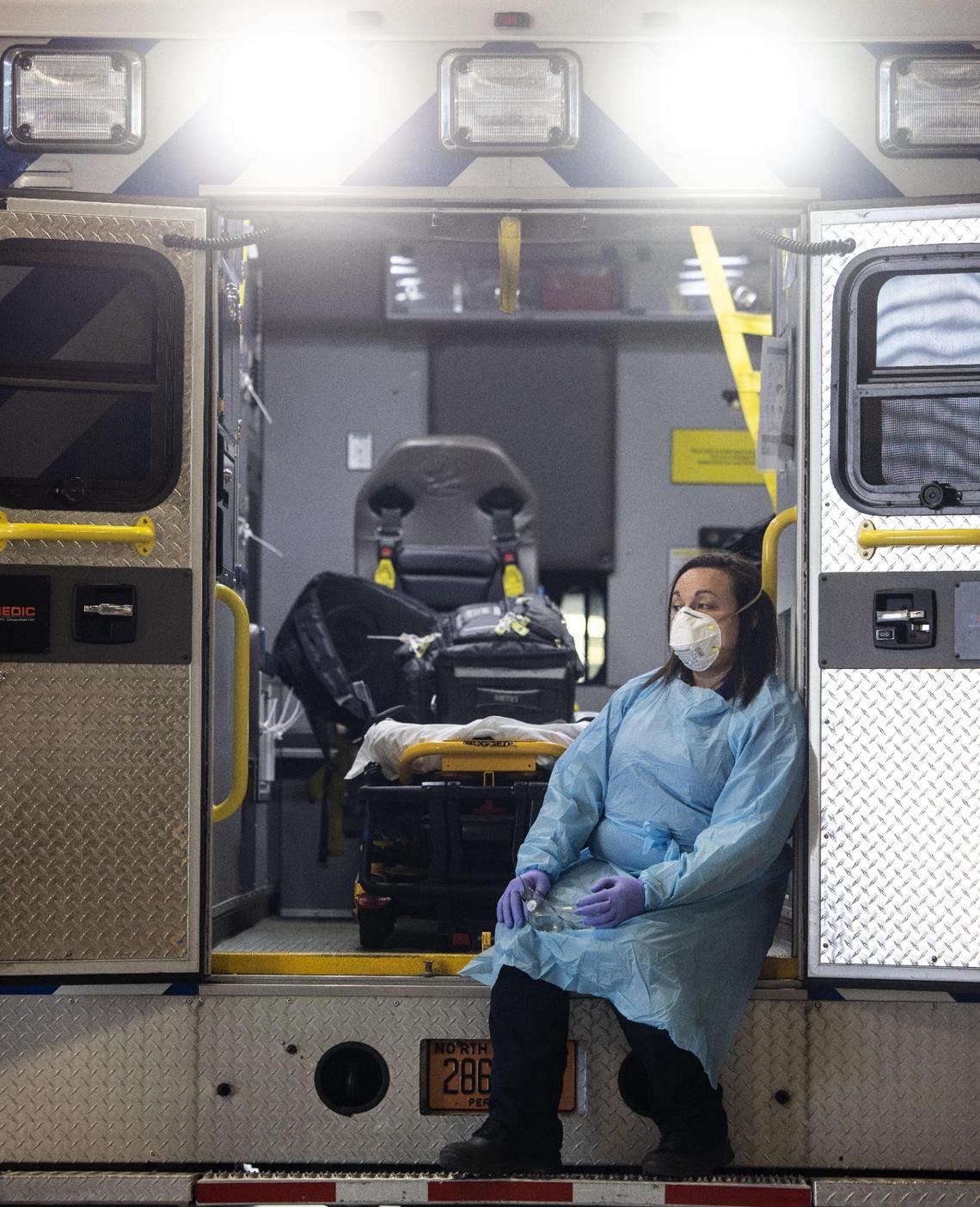 Paramedic crew chief Madison Kiger remembers the first time she had to wear full COVID-19 PPE. She was in the middle of a cardiac arrest call and had to step out to put on her gown.