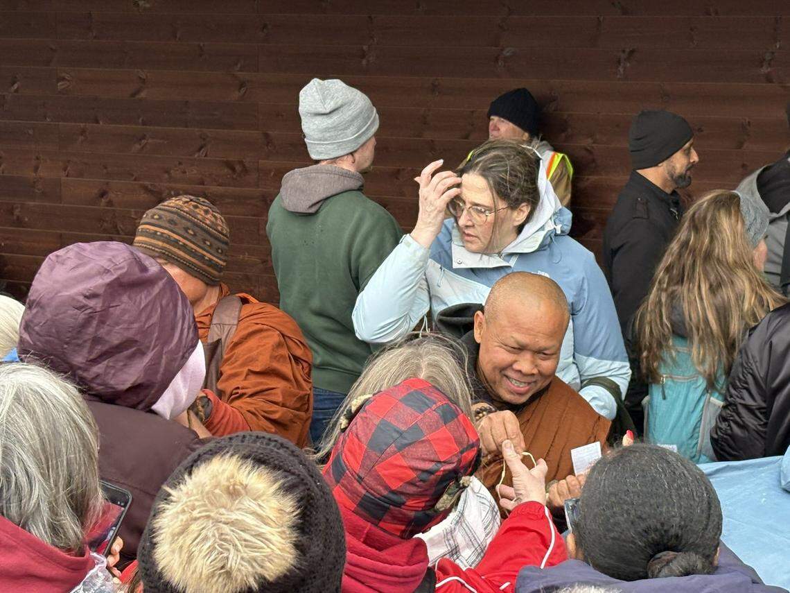 More than 1,000 visitors gathered Wednesday at Anne Springs Close Greenway to hear and receive string bracelets from monks on a walk from Texas to Washington, D.C.