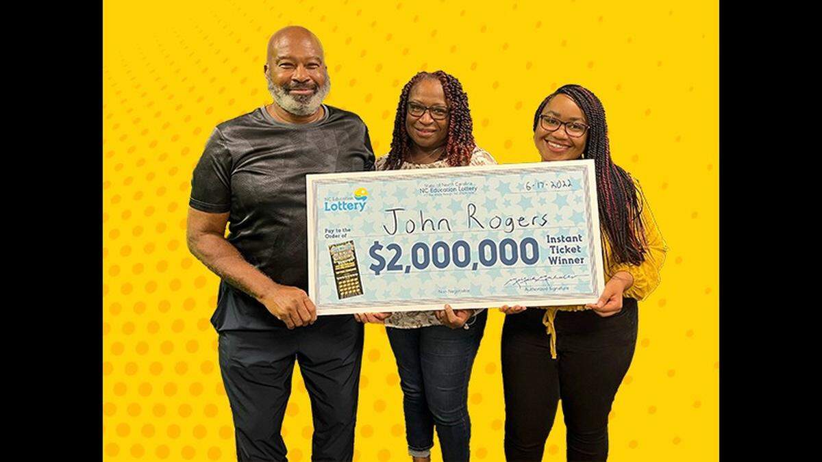 John Rogers of Raleigh poses with his wife, Charlene Rogers, and daughter, Ty’Anna Fleming, at NC lottery headquarters in Raleigh on Friday, June 17, 2022, after his $2-million scratch-off ticket jackpot win.