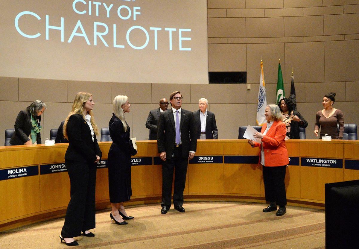 Edwin Peacock III (center) was sworn in to finish out Tariq Bokhari’s Charlotte City Council term, set to end in early December by Vi Lyles (right) last month.