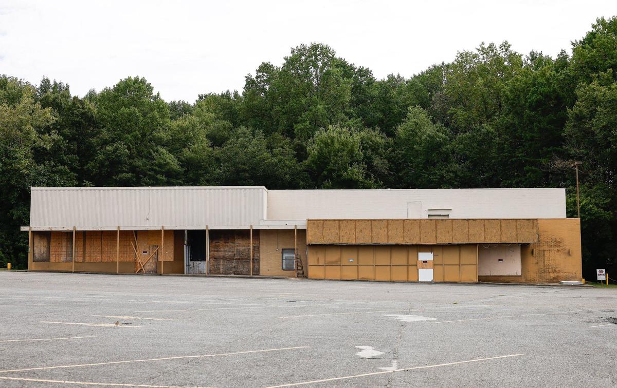 A former movie theater on Eastway Drive has been vacant and boarded up for years in east Charlotte, shown here on Wednesday, Sept. 4, 2024.