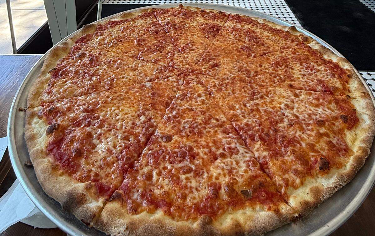 An 18” cheese pizza at Siano’s. The team behind the popular Waxhaw pizzeria is plotting a new restaurant set to open this spring.