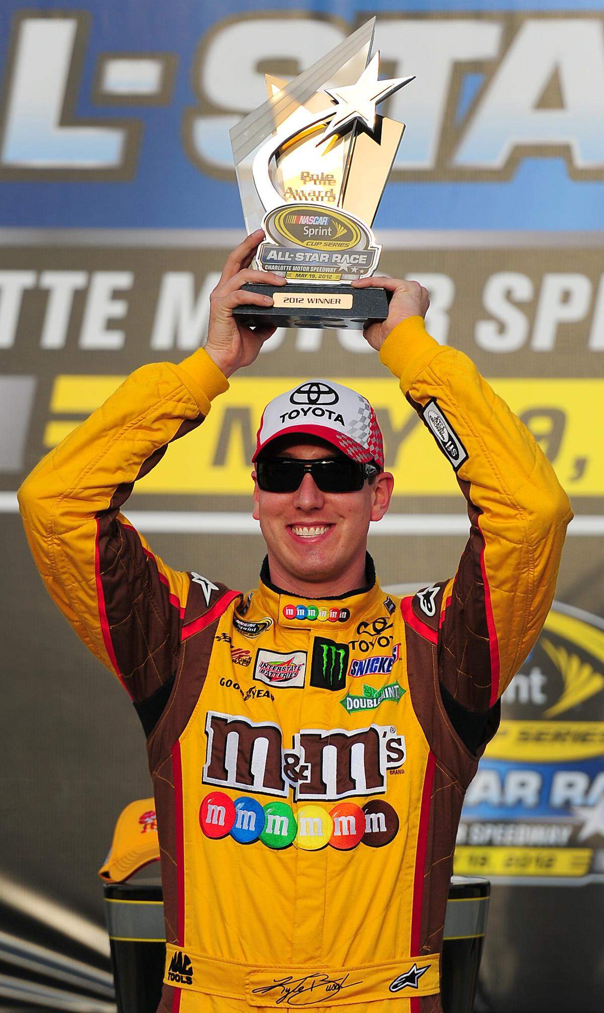 NASCAR Sprint Cup Series driver Kyle Busch celebrates his team's winning the pole for the Sprint All-Star Race in Victory Lane at Charlotte Motor Speedway in Concord, NC on Friday, May 18, 2012.  Jeff Siner - jsiner@charlotteobserver.com