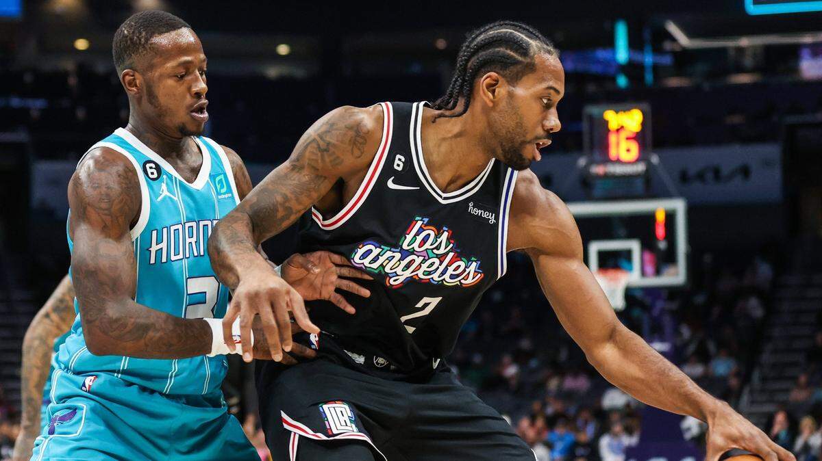 Hornets guard Terry Rozier, left, defends as Clippers forward Kawhi Loenard dribbles during the game against at Spectrum Center on Monday, December 5, 2022 in Charlotte, N.C.