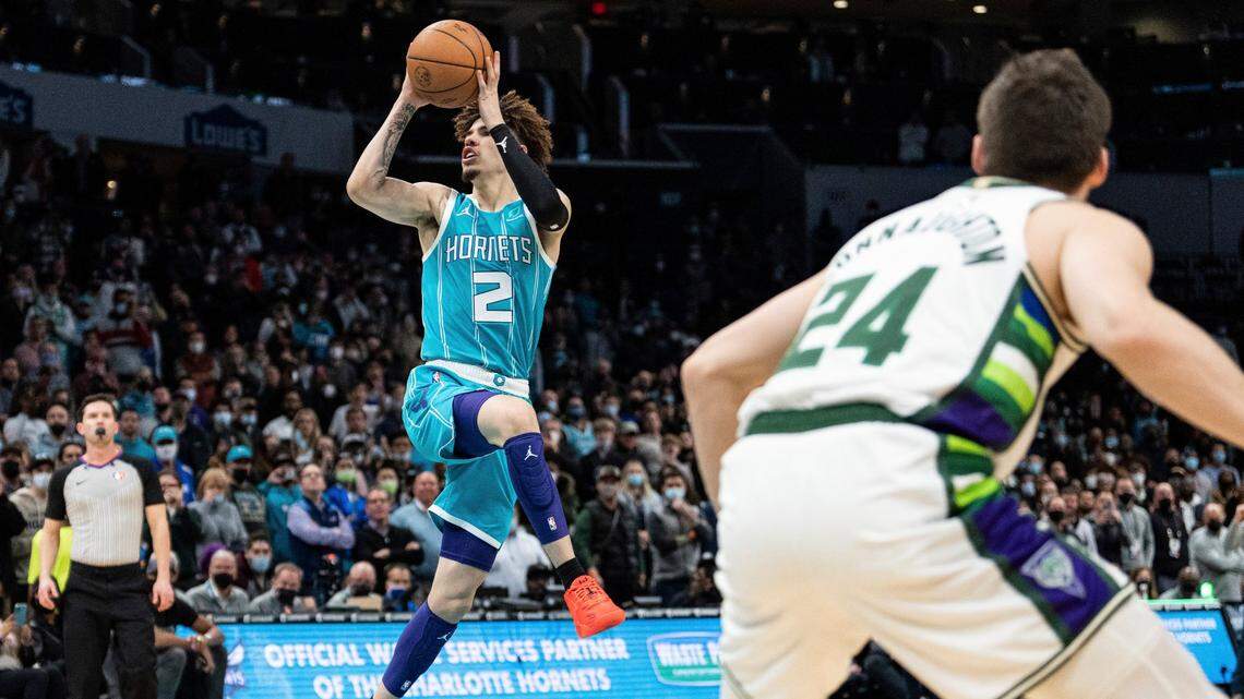 Charlotte Hornets guard LaMelo Ball shoots a floater in the lane late in the fourth quarter to break a 99-99 tie with 15.4 seconds left against the Milwaukee Bucks during an NBA basketball game in Charlotte, N.C., Monday, Jan. 10, 2022. The Hornets won, 103-99.