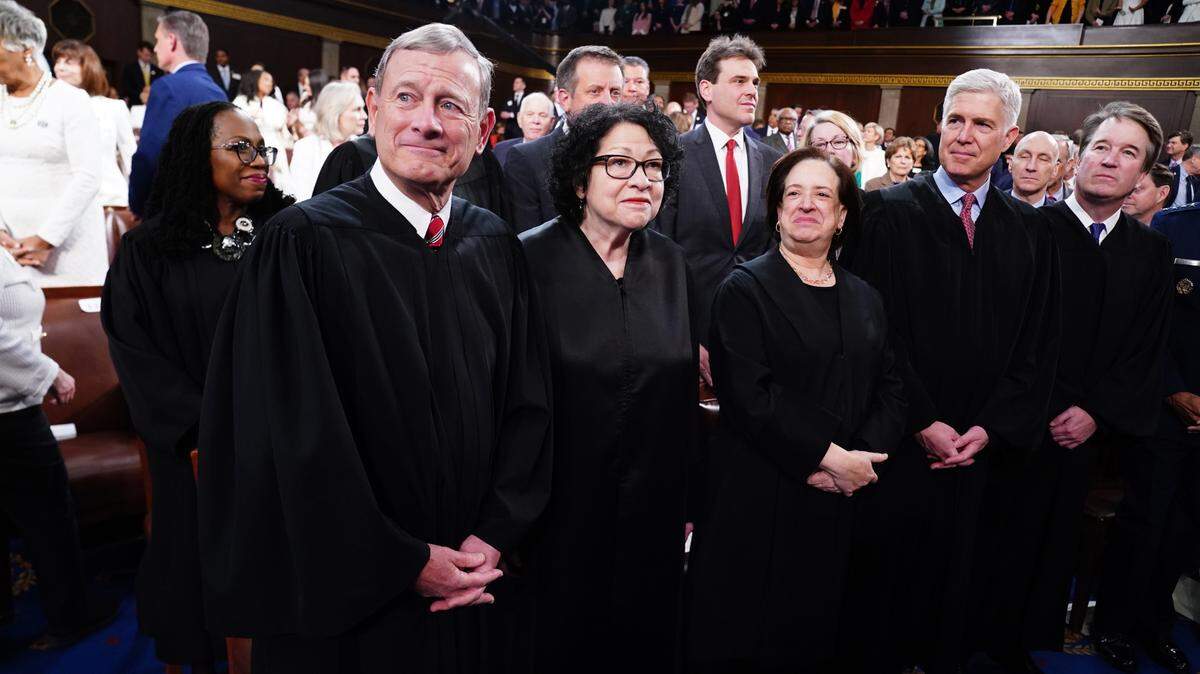 U.S. Supreme Court Chief Justice John Roberts (L), along with Associate Justices (L-R) Sonia Sotomayor, Elena Kagan, Neil Gorsuch and Brett Kavanaugh stand in the U.S. House on March 7, 2024 ahead of President Joe Biden’s third State of the Union address. Standing behind Roberts is Associate Justice Ketanji Brown Jackson.