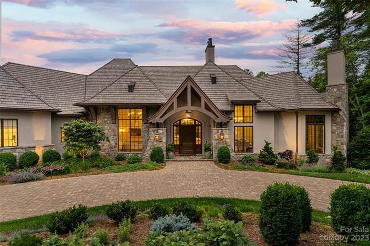 12 Landsdowne Ct. is surrounded by woods in the Ramble Biltmore Forest.
