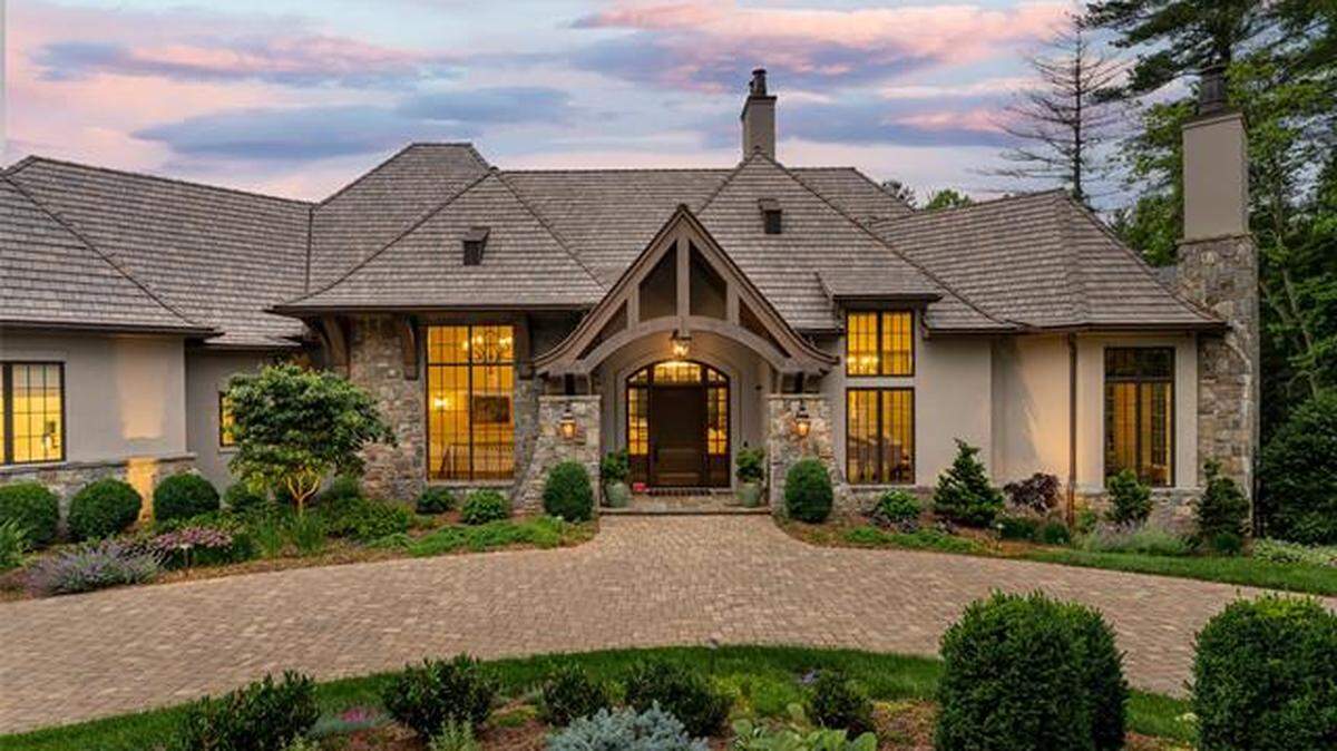 12 Landsdowne Ct. is surrounded by woods in the Ramble Biltmore Forest.
