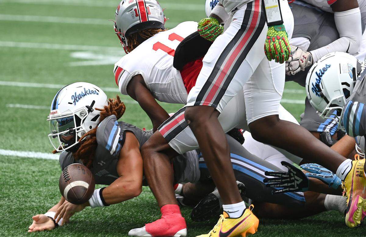 Hough Huskies quarterback Ethan Royal falls into the end zone for a touchdown during action against the South Pointe Stallions in the Keep Pounding Classic at Bank of America Stadium in Charlotte, NC on Friday, Aug. 22, 2025.