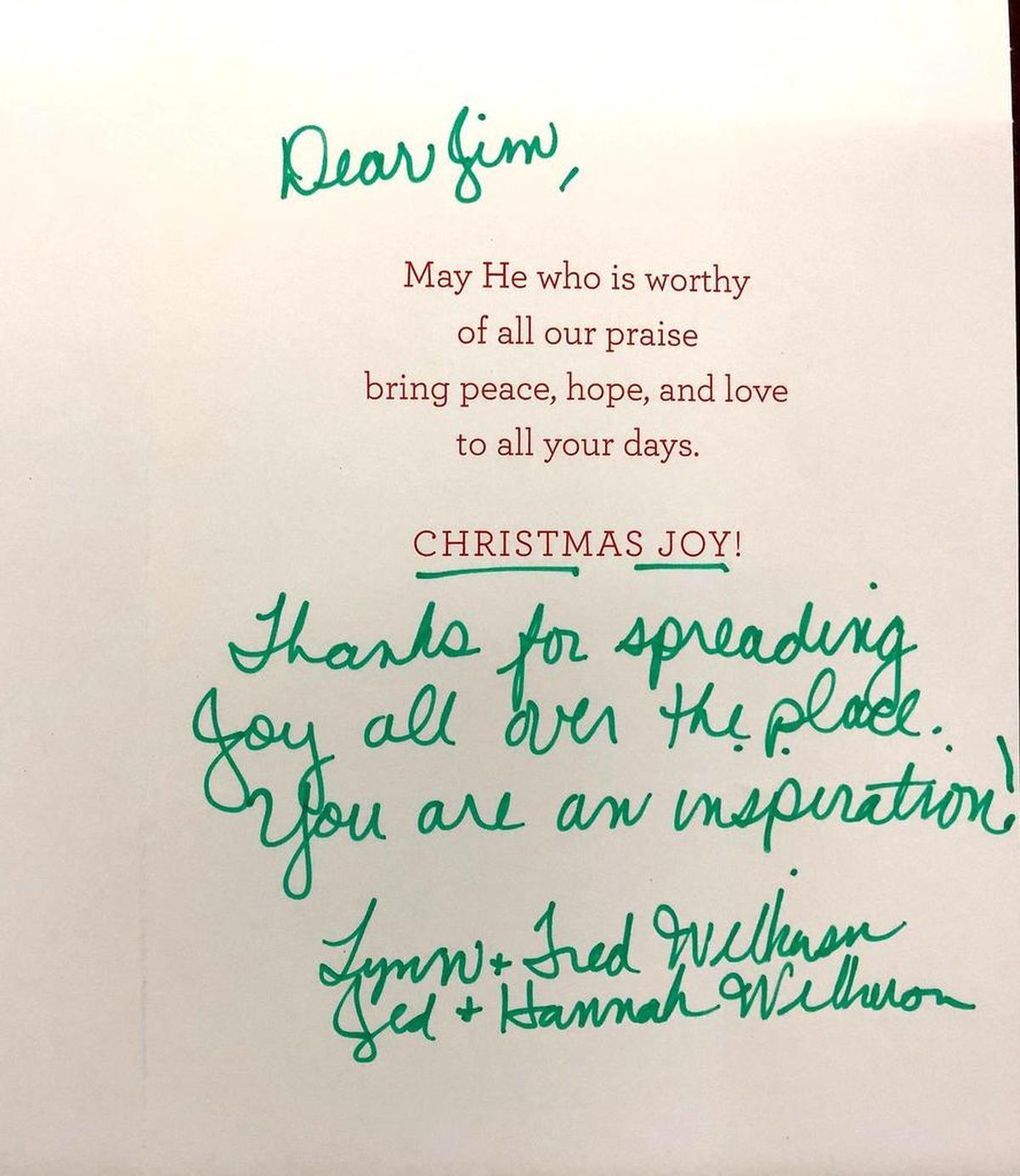 Jim Kobos keeps this Christmas card in his office at the credit union; it came from a fan who was touched by his enthusiasm at Hornets games.