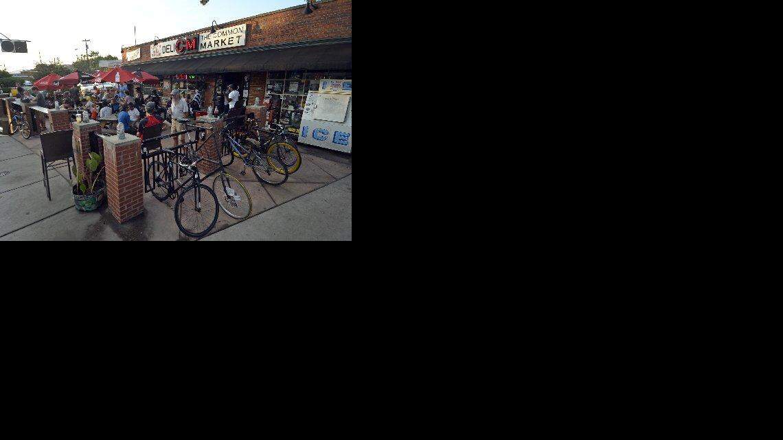 People and their bicycles gather at the Common Market for the Plaza Midwood Tuesday Night Ride. As the day passes, the market slowly transforms into a very popular bar.