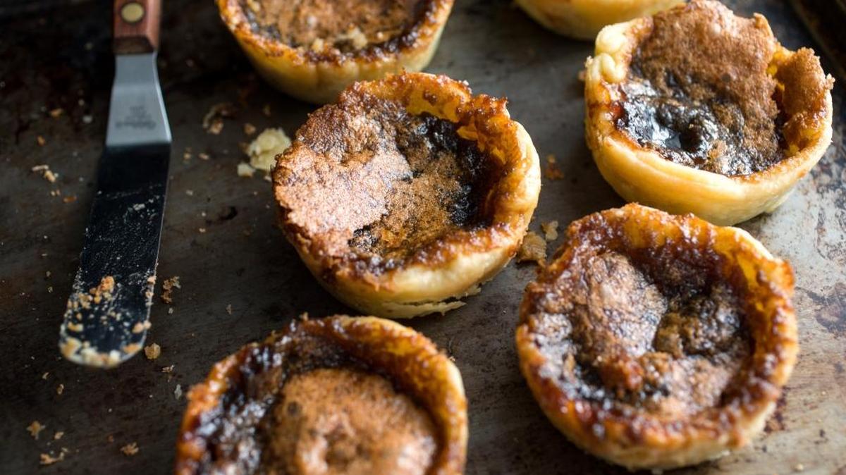 Butter tarts made with dark brown sugar will have a darker brown filling after baking.