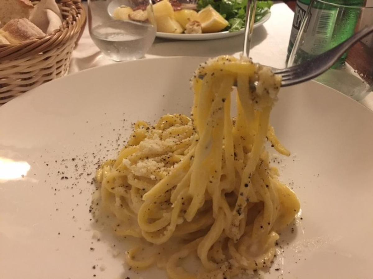 Cacio de pepe, Rome’s beloved dish, is simply parmesan and usually a little pecorino and lots of black pepper tossed with hot pasta and sometimes a little starchy pasta water.