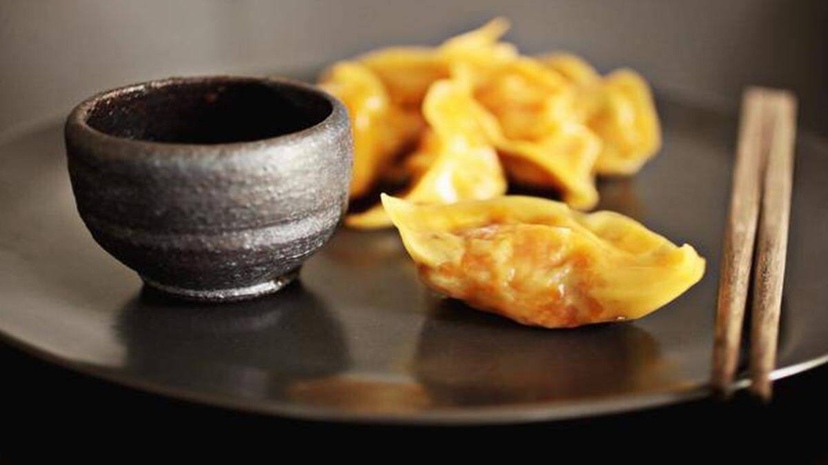 
These Roasted Kabocha and Vegetable Dumplings are folded into pleated crescents.
