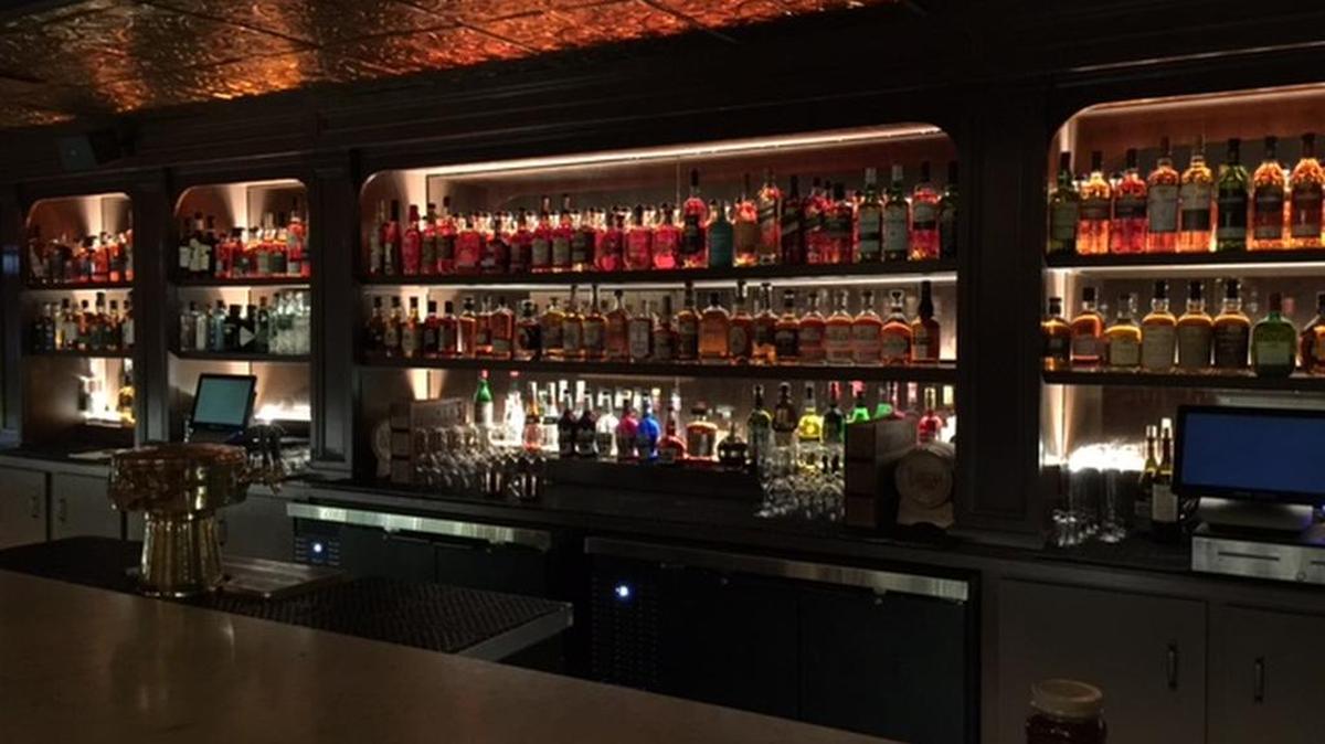 The bar behind Dot Dot Dot is loaded and ready to go, with several hundred bottles and more to come.