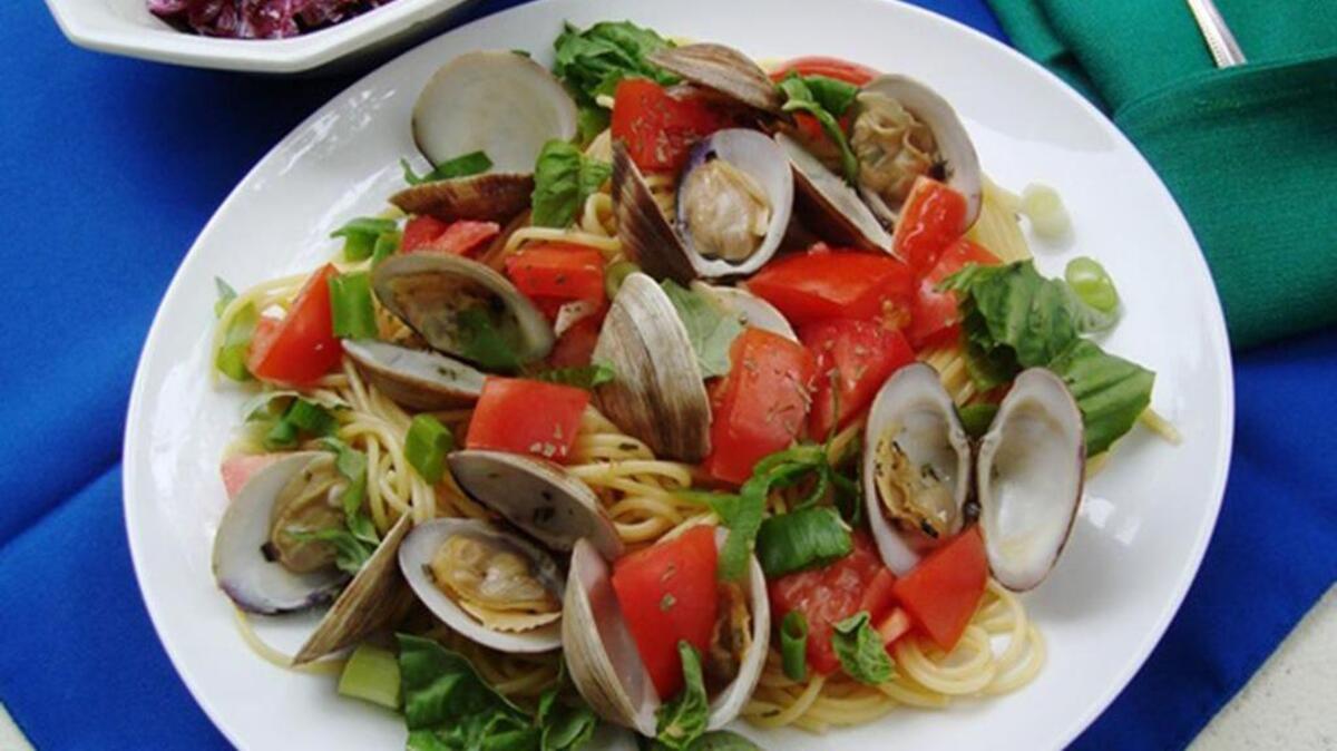 Spaghettini with clams and herb sauce.