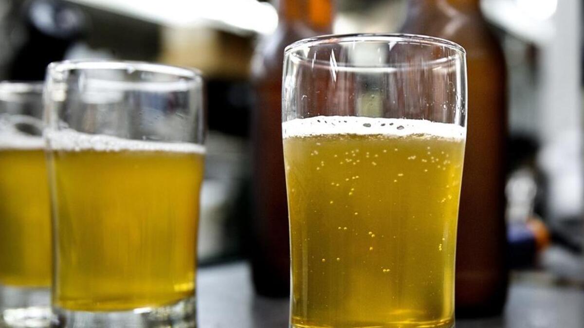 
Samples of beer made with the yeast from bees are poured by Dr. John Sheppard, with the NC State University Department of Food/Bioprocessing and Nutrition Sciences, in the Brewery in the Pilot Plant on the school's campus in Raleigh, N.C. on Thursday, July 23, 2015. 
