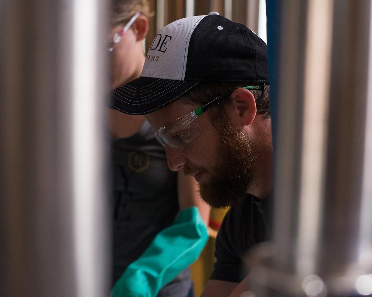 Hyde Brewing's Daniel Mcilmoyle makes adjustments to the tanks. McIlmoyle attended a brewing college in Germany.
