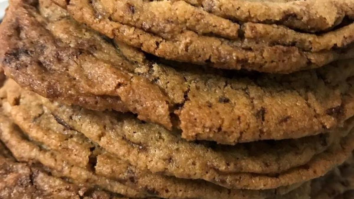 Repeatedly banging the sheet of cookies while they bake creates cookies with concentric rings and a combination of crispy edges and soft centers.