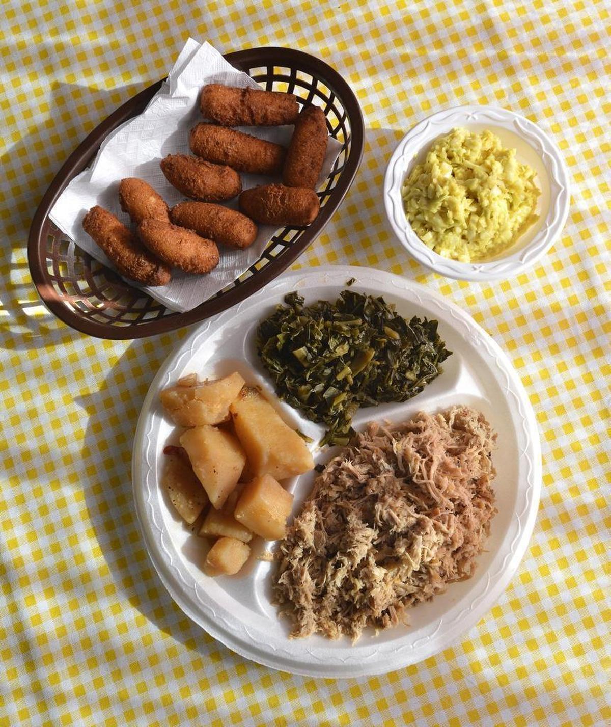 The pork plate at Bill Spoon’s Barbecue: Chopped pork, with sides of cole slaw (yellow, of course), collards, potatoes and hush puppies.