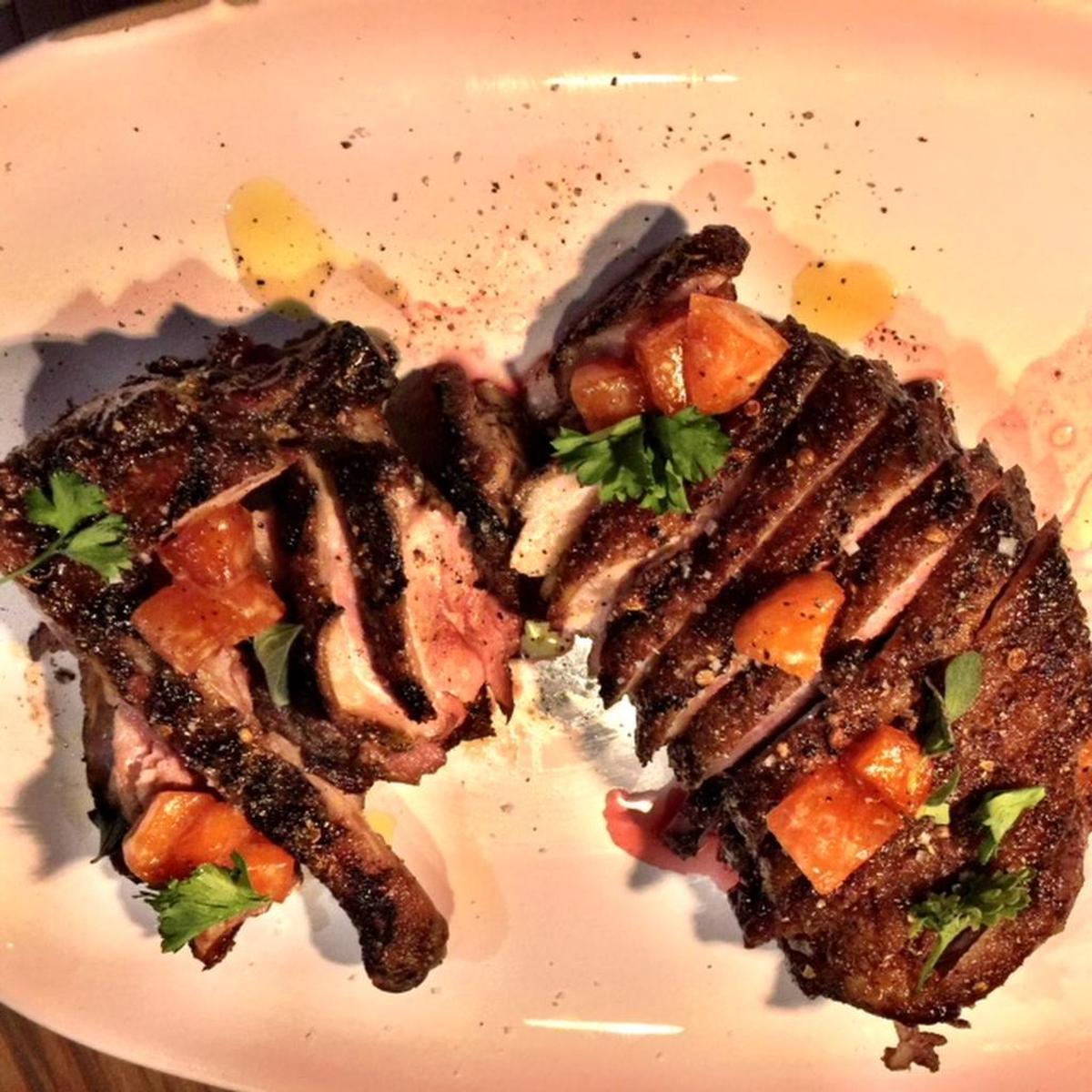 Vince Giancarlo’s crispy duck is dry-aged, air-dried and flavored with honey, sansyo pepper, coriander, arnaud olive oil and compressed persimmon.