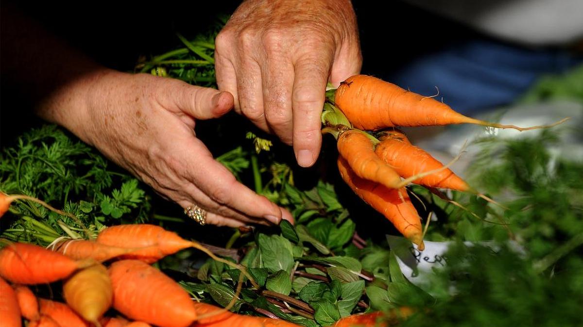 Organic bagged whole and baby carrots sold at grocery stores with locations in the Raleigh area have been linked to an E. coli outbreak.