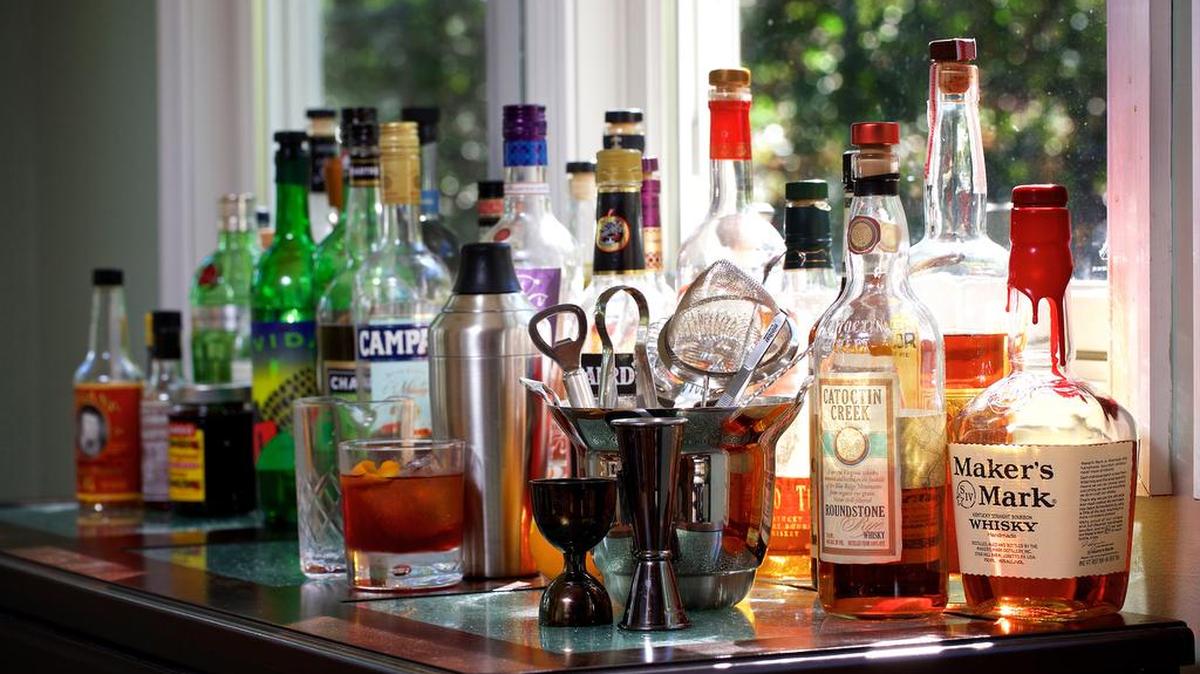 You can stock your home bar a few bottles at a time.