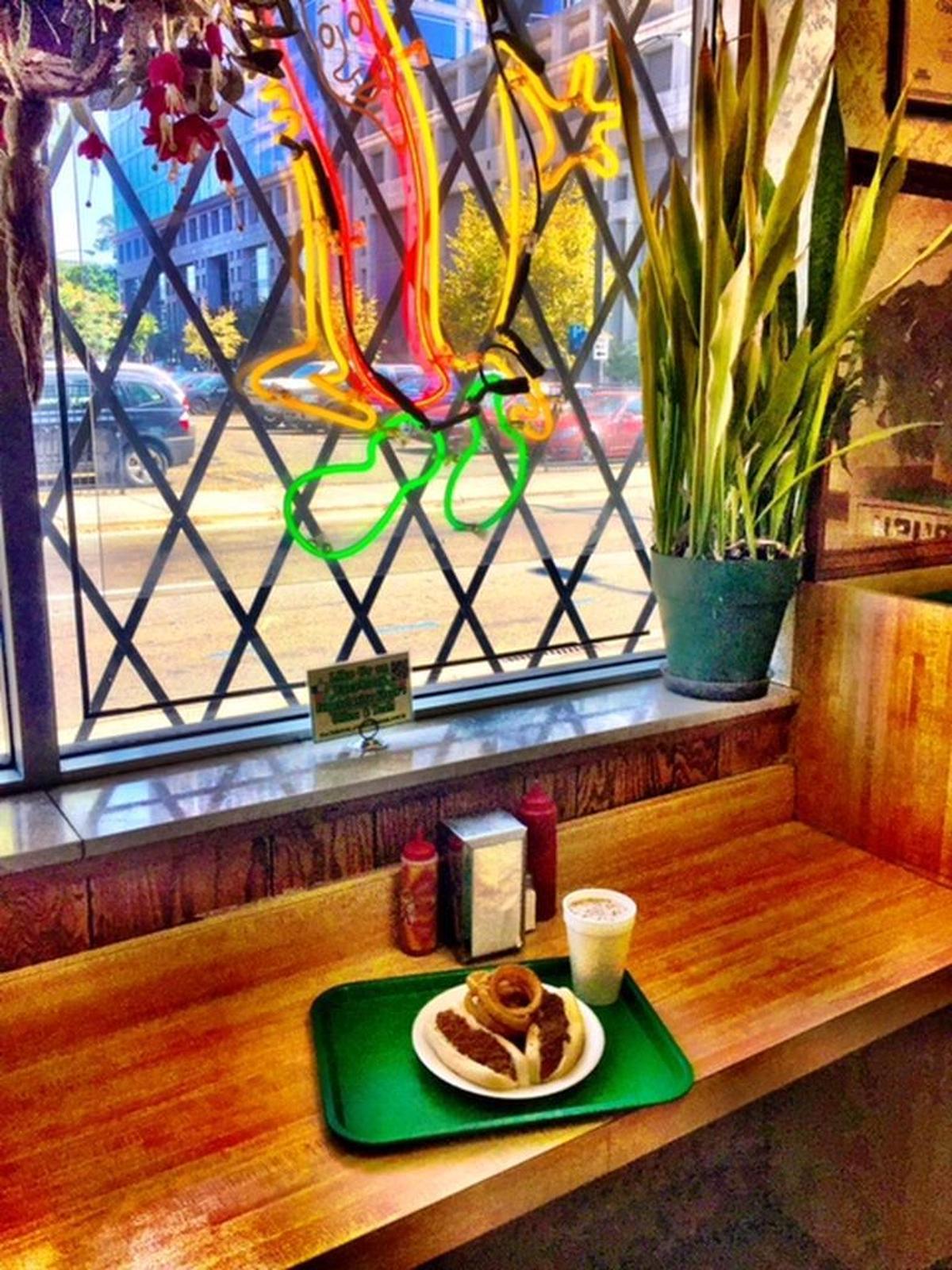The neon signs still glow over the counter at Green’s Lunch.