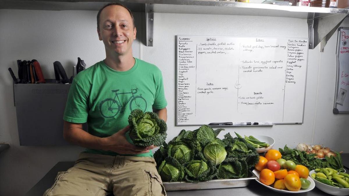 Trey Wilson often grows produce in his own garden for his kitchen at Customshop on Elizabeth Avenue.