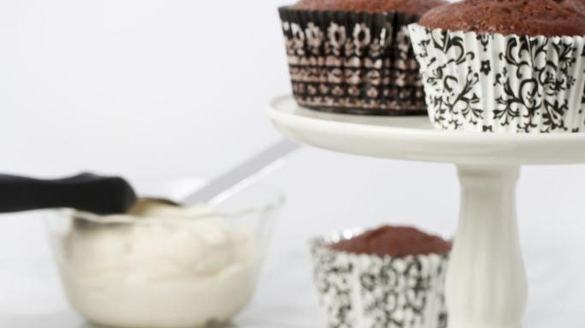 Cocoa Cupcakes are lower in fat from cocoa, and a yogurt topping makes them even more of a treat.