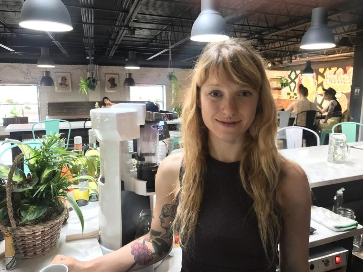 Lindsey Pitman behind the counter at Trade and Lore.