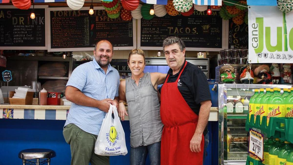 Joe and Katy Kindred, with Rodolfo Montero Gracia, who owns the sandwich counter at Sav/Way Foods on Central Avenue. Montero used to own the Dilworth restaurant Tio Montero.