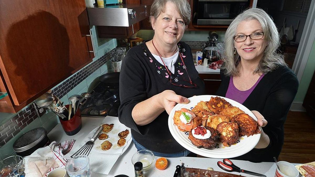 Kathleen Purvis (left) and Amy Rogers got together for latke lessons. Before you tackle this year’s Hannukah favorite, let Rogers give you a little advice.