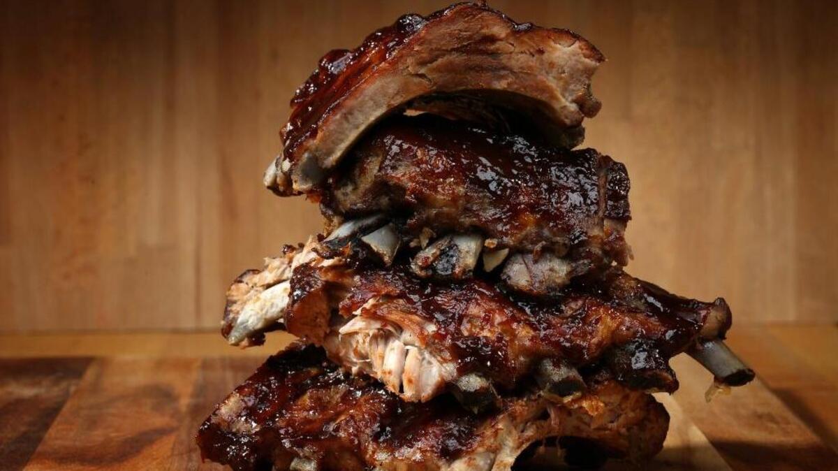 Slow-grilled ribs are the epitome of summer grilling season.