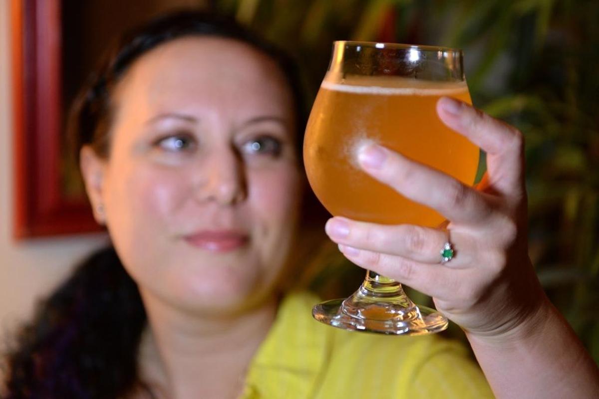 Jen Blair holds a glass of her finished grisette.