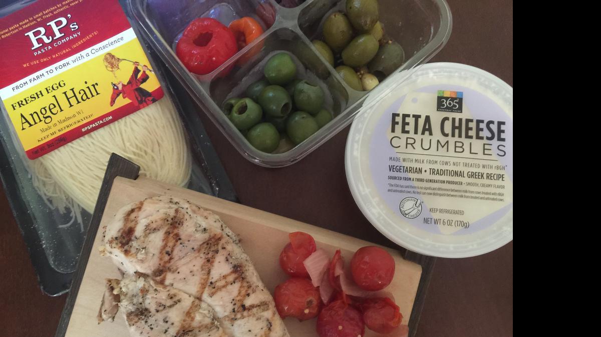 
Easy ingredients for a fast dinner: Fresh pasta, crumbled feta, olives, pappadew peppers, marinated tomatoes and a grilled chicken breast. 
