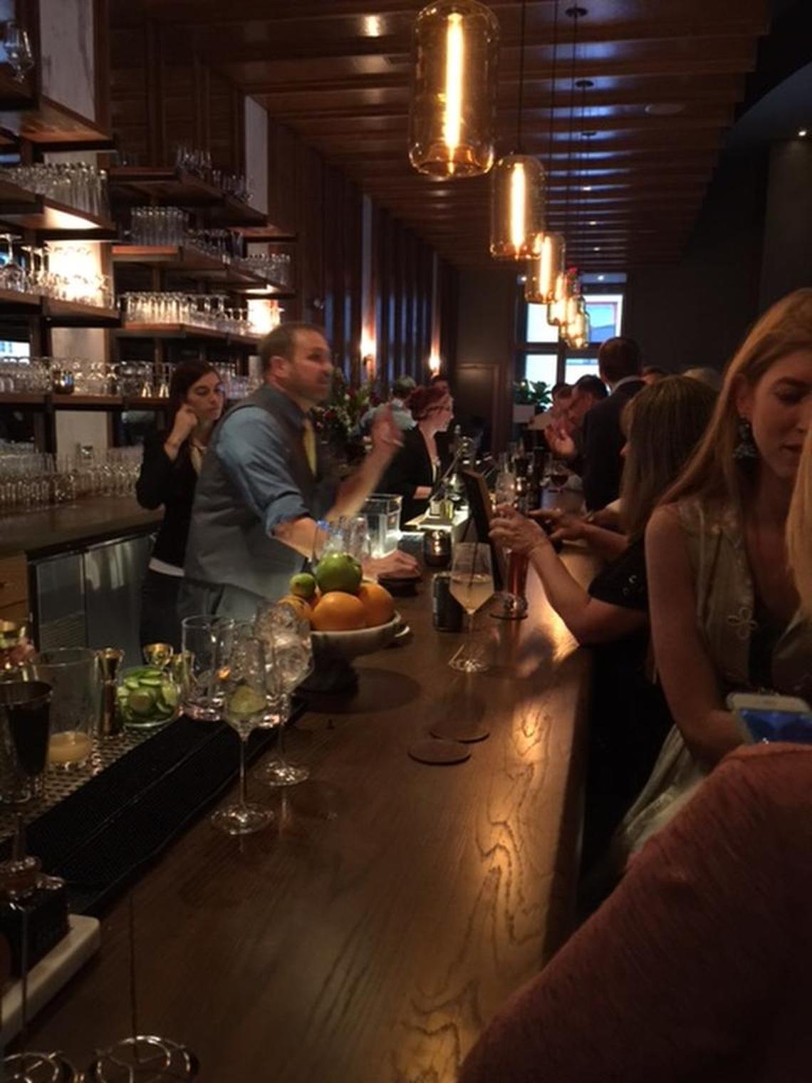 The long bar at Oak Steakhouse was packed for the preview Thursday night.