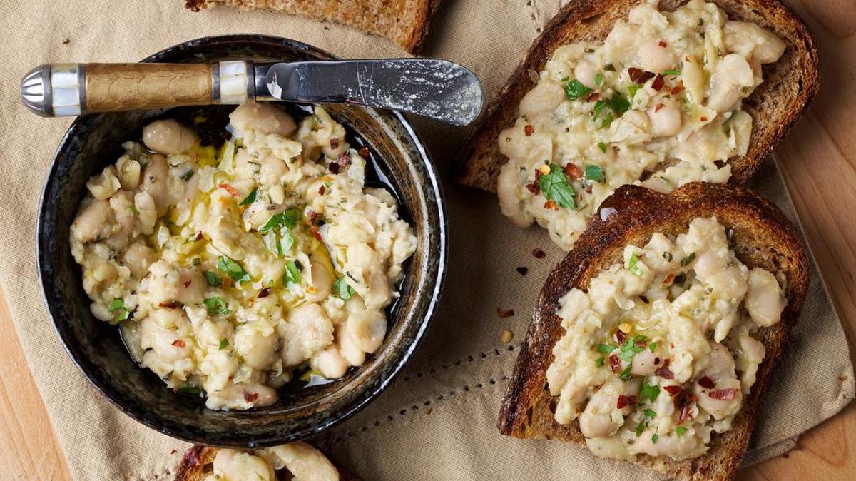 Garlic-Rosemary White Bean Toasts take all of 15 minutes to whip up with ingredients that are easy to keep on hand - so it's perfect for surprise guests.