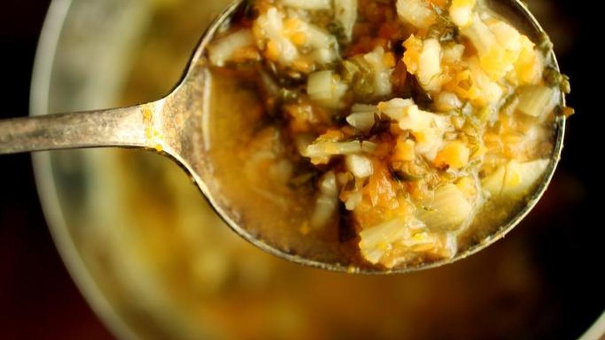 Chicken soup, like this carrot top soup from “Local Flavors: Cooking and Eating from America’s Market,” can be a cure for the crud.