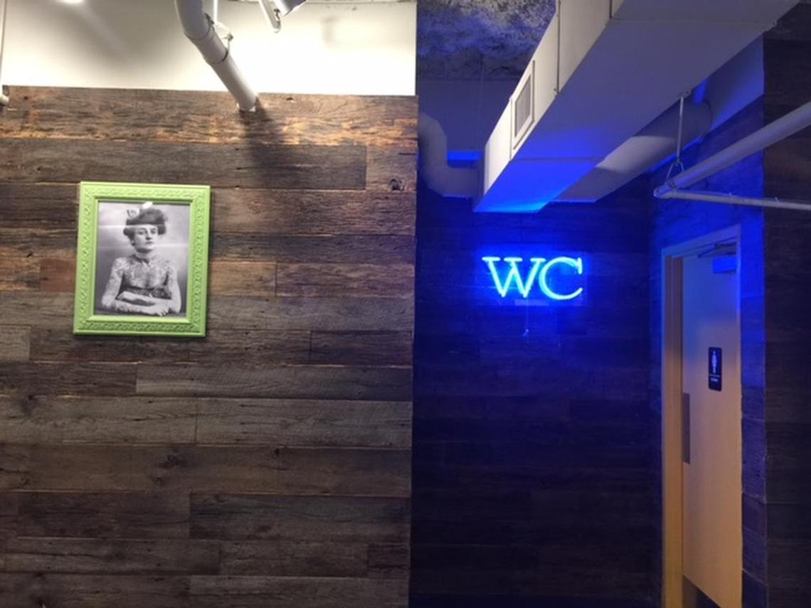 Owner Michael Shortino calls the portrait of a woman with a chest of tattoos “a woman ahead of her time.”