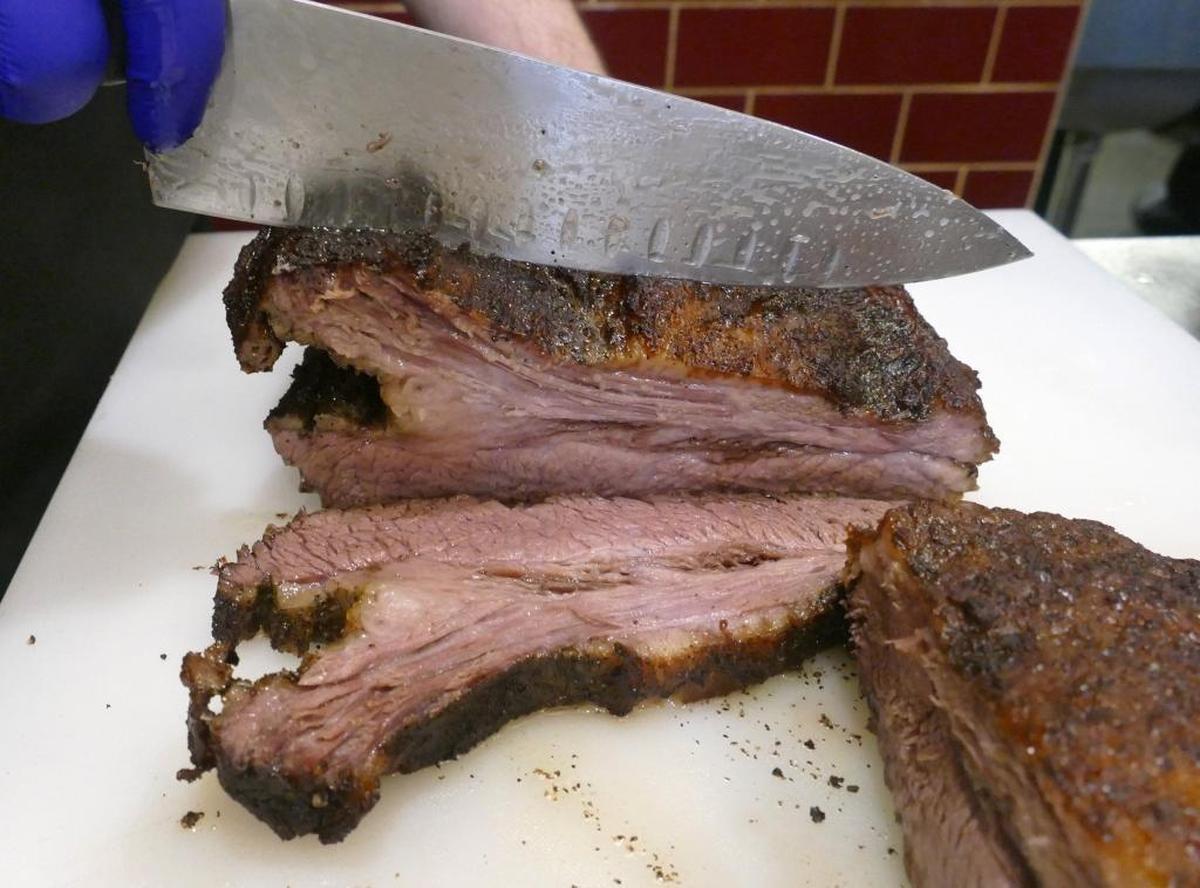 Slicing brisket at City Smoke.
