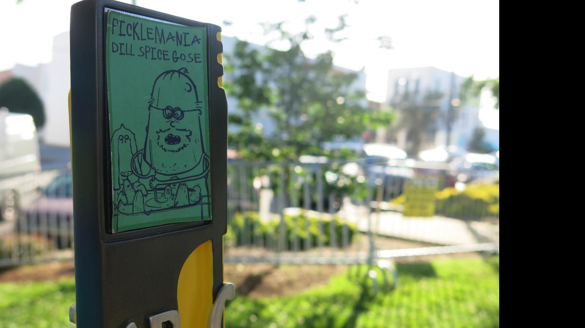 
 The tap handle for Picklemania, a Gose brewed with sea salt, peppercorns, allspice and dill that is a partnership between Steel String Brewery and Haw River Farmouse Ales. 
