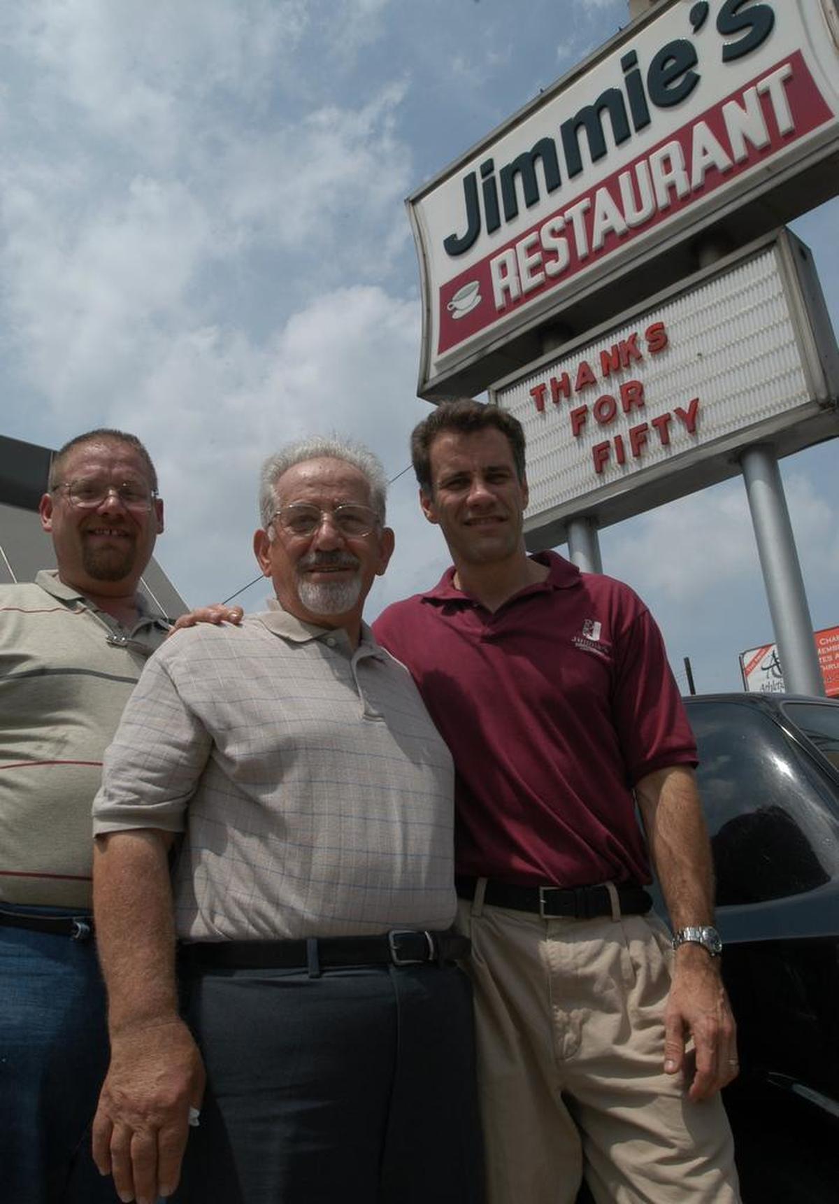 Jimmie Pourlos, center, with his son Chris, right. Pourlos’ son George, left, died before his father.