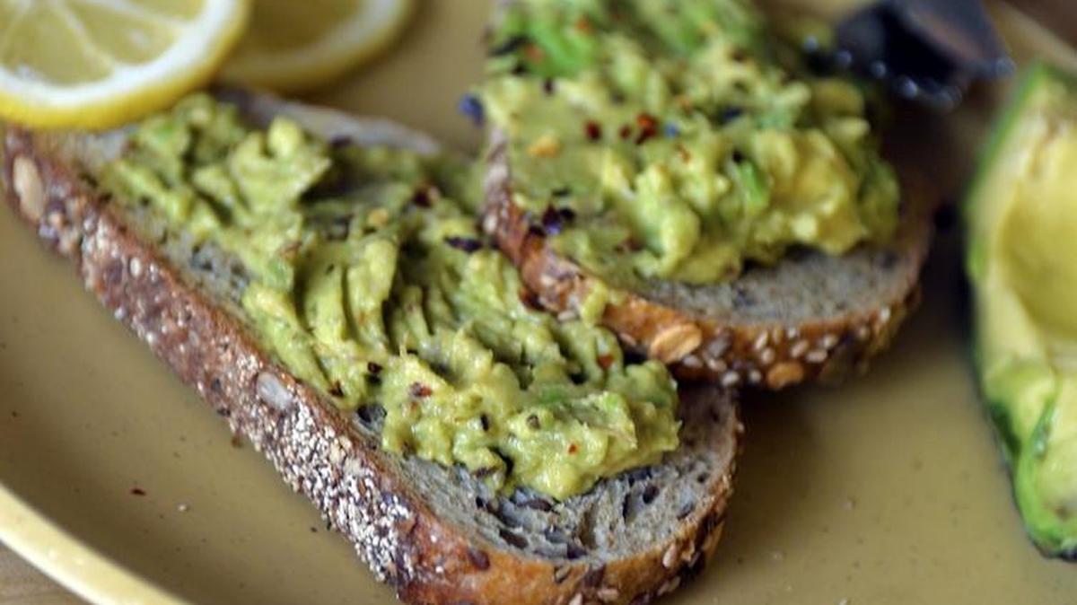 How can you keep the rest of an avocado fresh and green after your avocado toast?