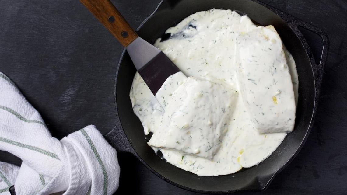 Worried about overcooking fish? A simple (and low-fat) cream sauce will keep this weeknight halibut from being too dry.